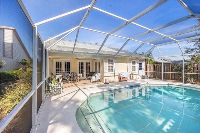 7716 Geneva Ln, Sarasota, FL 34243 - swimming pool featuring french doors, a patio, and glass enclosure