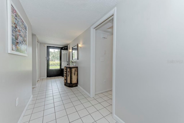 7110 Fairway Bend Ln Unit 181, Sarasota, FL 34243 - hallway with a textured ceiling and light tile patterned floors