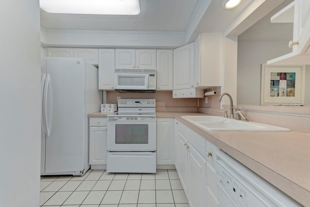 7110 Fairway Bend Ln Unit 181, Sarasota, FL 34243 - kitchen with white appliances, white cabinetry, light tile patterned floors, light countertops, and ornamental molding