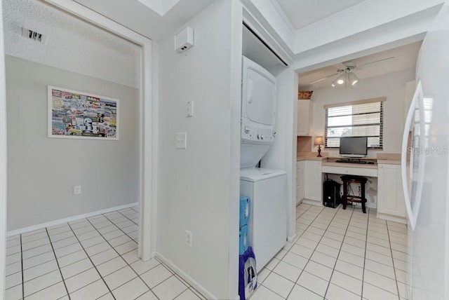 7110 Fairway Bend Ln Unit 181, Sarasota, FL 34243 - laundry area with stacked washer / drying machine, ceiling fan, light tile patterned flooring, and a desk