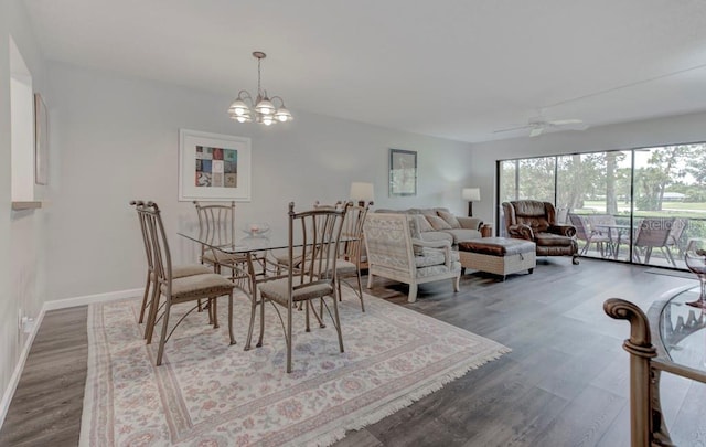 7110 Fairway Bend Ln Unit 181, Sarasota, FL 34243 - dining area with wood finished floors, a chandelier, and ceiling fan
