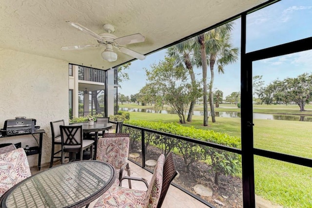 7110 Fairway Bend Ln Unit 181, Sarasota, FL 34243 - sunroom / solarium with outdoor dining space, a water view, and a ceiling fan