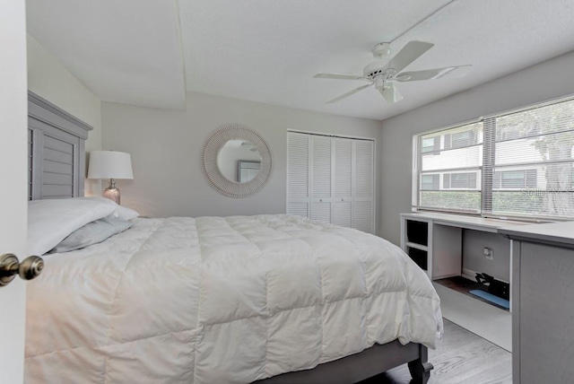 7110 Fairway Bend Ln Unit 181, Sarasota, FL 34243 - bedroom with light wood finished floors, ceiling fan, and a closet