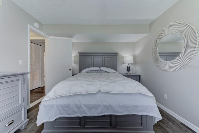 7110 Fairway Bend Ln Unit 181, Sarasota, FL 34243 - bedroom with dark wood-style flooring and baseboards