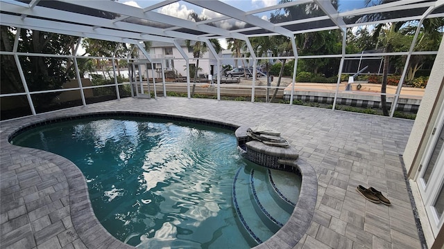 1240 Solitude Ln, Sarasota, FL 34242 - swimming pool featuring a patio area and glass enclosure