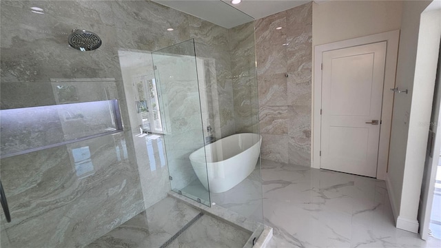 1240 Solitude Ln, Sarasota, FL 34242 - bathroom featuring marble tiled flooring, a marble finish shower, a soaking tub, and tile walls