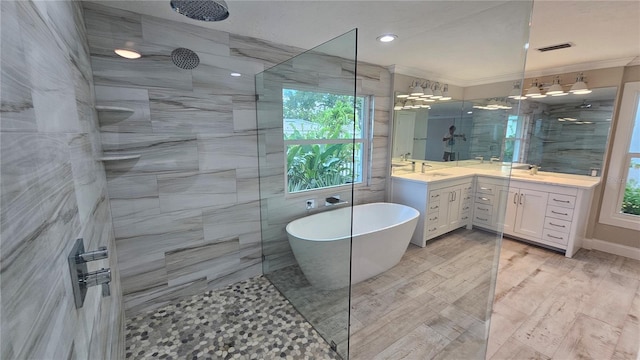 1240 Solitude Ln, Sarasota, FL 34242 - bathroom featuring ornamental molding, walk in shower, a soaking tub, vanity, and recessed lighting