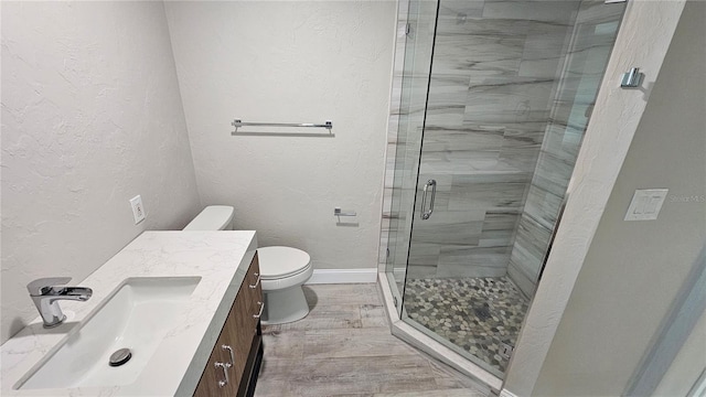 1240 Solitude Ln, Sarasota, FL 34242 - bathroom with vanity, a shower stall, and a textured wall