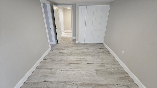 1240 Solitude Ln, Sarasota, FL 34242 - unfurnished bedroom featuring wood finished floors and a closet