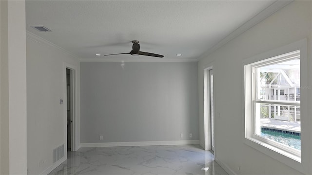 1240 Solitude Ln, Sarasota, FL 34242 - spare room featuring healthy amount of natural light, marble finish flooring, ornamental molding, ceiling fan, and a textured ceiling