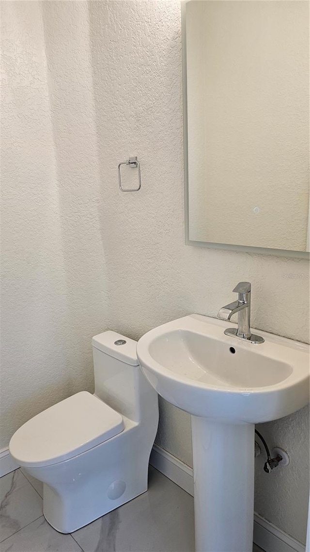 1240 Solitude Ln, Sarasota, FL 34242 - half bath with a textured wall