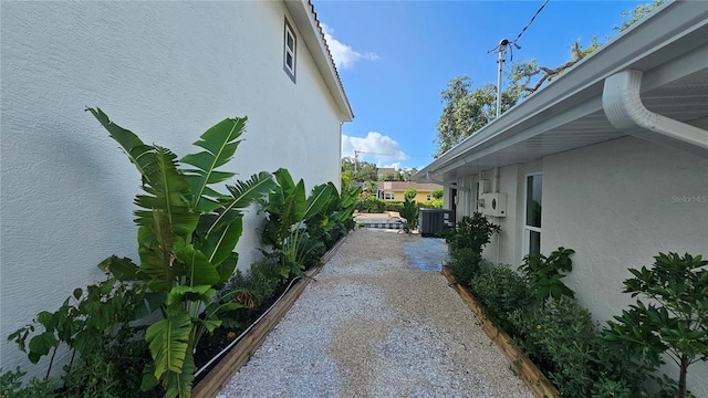 1240 Solitude Ln, Sarasota, FL 34242 - view of home's exterior with stucco siding and a cooling unit