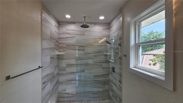 1240 Solitude Ln, Sarasota, FL 34242 - full bathroom featuring a tile shower, recessed lighting, and a textured wall
