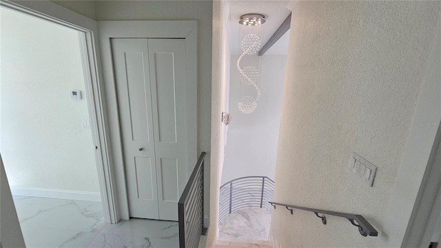 1240 Solitude Ln, Sarasota, FL 34242 - stairs with a textured wall and marble finish floors