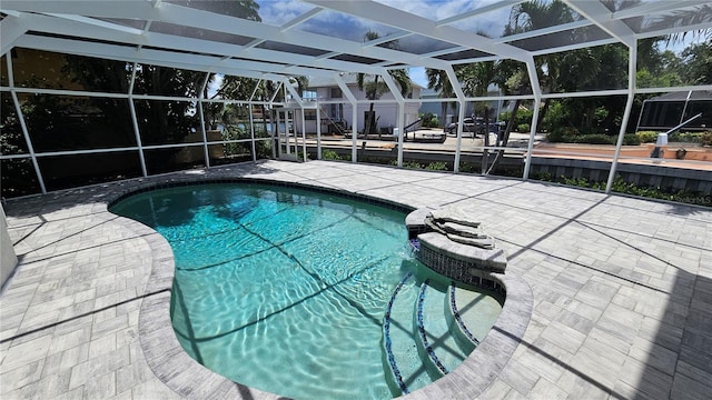 1240 Solitude Ln, Sarasota, FL 34242 - outdoor pool featuring a patio and glass enclosure
