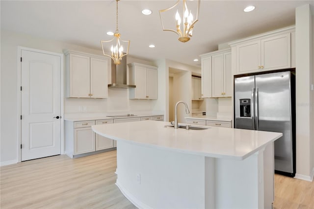 918 Fernleaf Run, Bradenton, FL 34212 - kitchen featuring stainless steel fridge with ice dispenser, a chandelier, black electric stovetop, light wood-type flooring, and light countertops