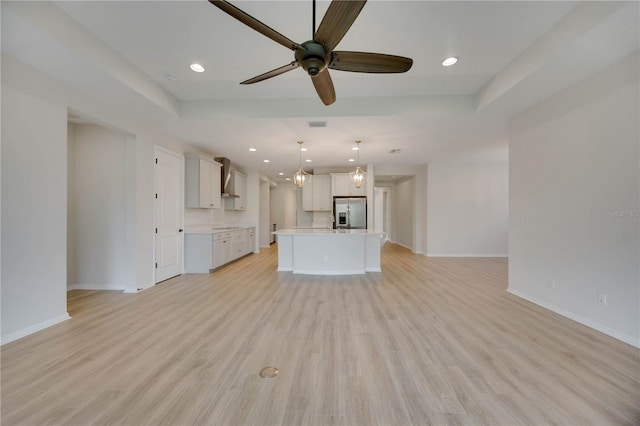 918 Fernleaf Run, Bradenton, FL 34212 - unfurnished living room with ceiling fan, light wood-style flooring, and recessed lighting