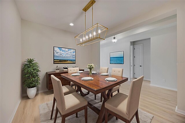 918 Fernleaf Run, Bradenton, FL 34212 - dining room with light wood-style flooring, a chandelier, and recessed lighting