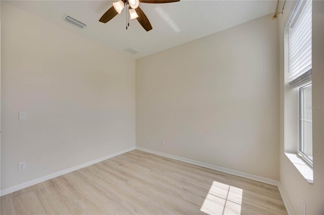 918 Fernleaf Run, Bradenton, FL 34212 - empty room with a ceiling fan and light wood-style floors