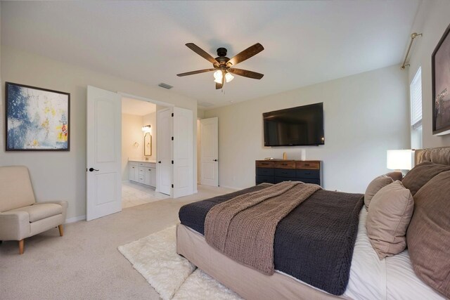 918 Fernleaf Run, Bradenton, FL 34212 - bedroom with light carpet, a ceiling fan, and ensuite bath