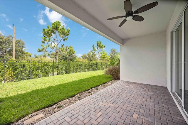 918 Fernleaf Run, Bradenton, FL 34212 - fenced backyard with a ceiling fan and a patio