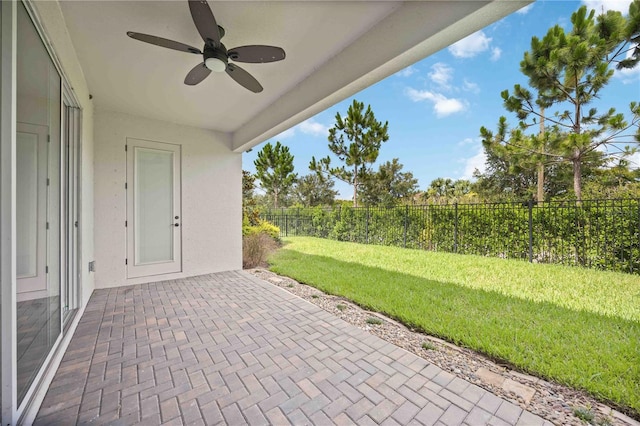 918 Fernleaf Run, Bradenton, FL 34212 - fenced backyard with ceiling fan and a patio