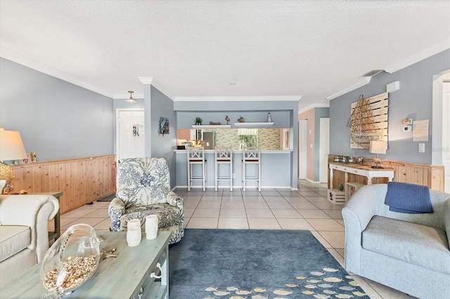 3810 75th St W Unit 128, Bradenton, FL 34209 - tiled living area with crown molding and a textured ceiling
