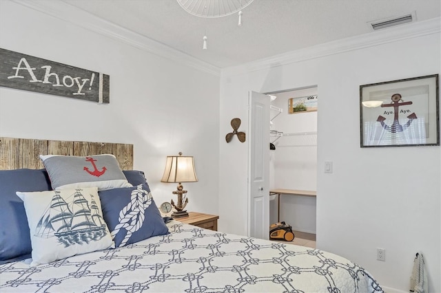 3810 75th St W Unit 128, Bradenton, FL 34209 - bedroom with crown molding and a spacious closet
