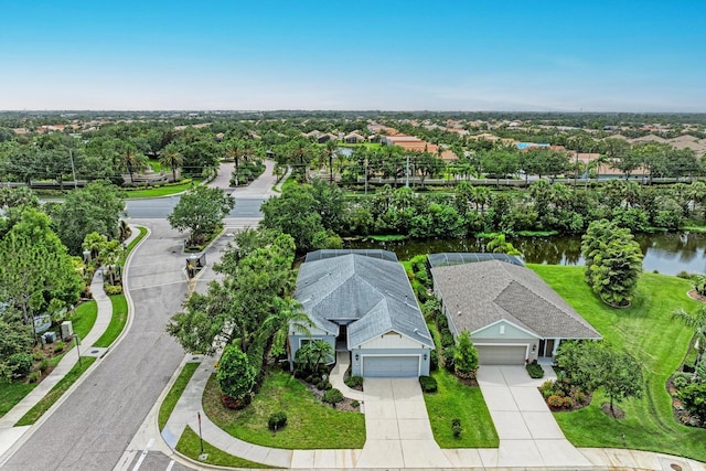 6516 Palm Leaf Ct, Sarasota, FL 34243 - view of subject property with a nearby body of water and a tree filled landscape