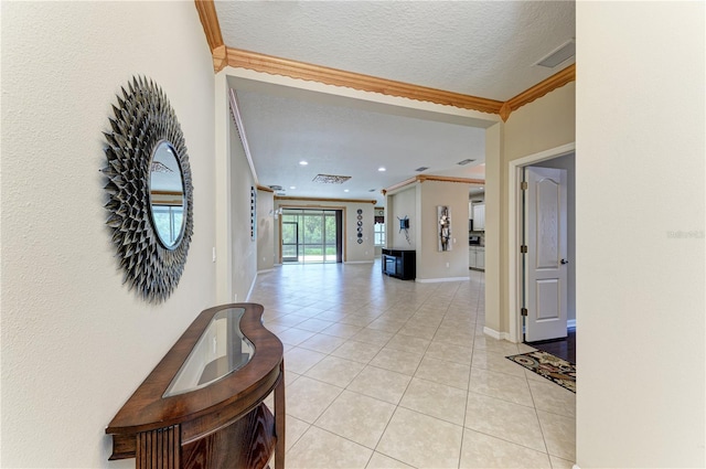 6516 Palm Leaf Ct, Sarasota, FL 34243 - corridor featuring light tile patterned floors, ornamental molding, a textured ceiling, and recessed lighting