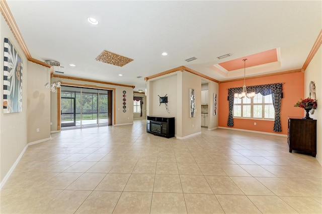 6516 Palm Leaf Ct, Sarasota, FL 34243 - unfurnished living room with crown molding, a chandelier, light tile patterned flooring, recessed lighting, and a tray ceiling