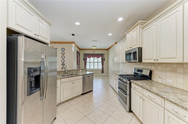 6516 Palm Leaf Ct, Sarasota, FL 34243 - kitchen with stainless steel appliances, light tile patterned floors, crown molding, tasteful backsplash, and light stone counters