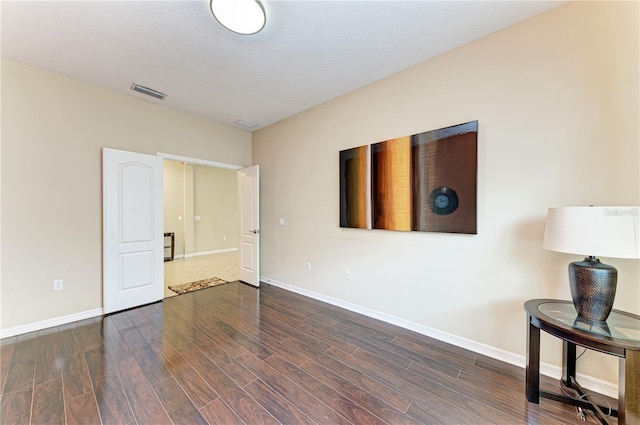 6516 Palm Leaf Ct, Sarasota, FL 34243 - unfurnished room with baseboards and wood finished floors