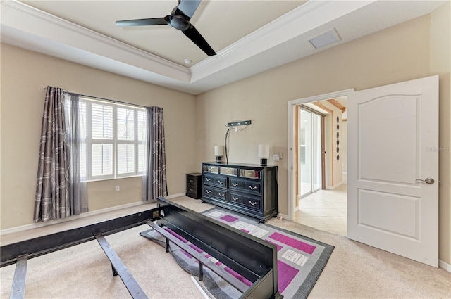 6516 Palm Leaf Ct, Sarasota, FL 34243 - bedroom featuring crown molding, light colored carpet, a tray ceiling, and a ceiling fan