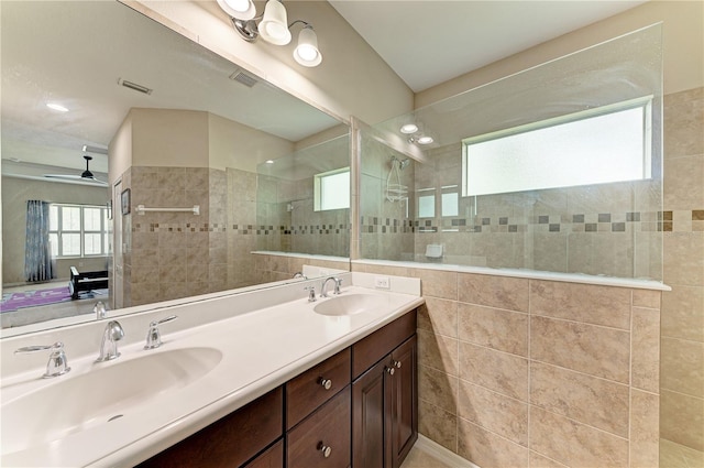 6516 Palm Leaf Ct, Sarasota, FL 34243 - full bathroom with walk in shower, double vanity, ensuite bathroom, and tile walls