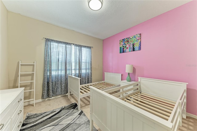 6516 Palm Leaf Ct, Sarasota, FL 34243 - bedroom featuring light colored carpet and a textured ceiling