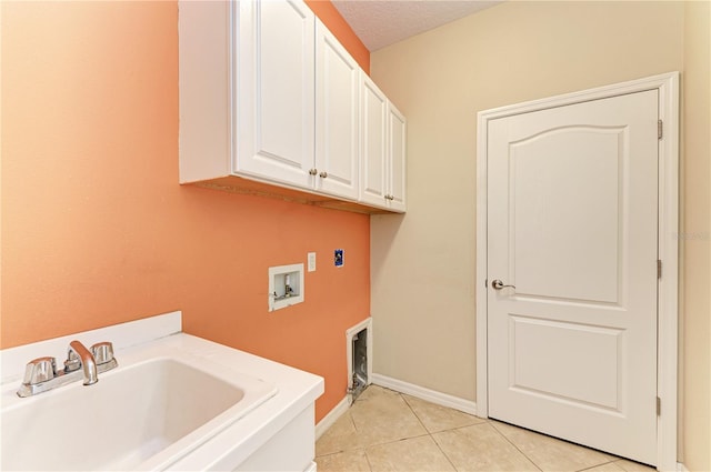 6516 Palm Leaf Ct, Sarasota, FL 34243 - laundry room featuring cabinet space, washer hookup, and light tile patterned floors
