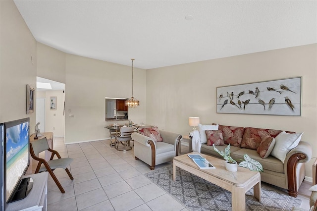 3617 Yellow Pine Ct Unit 144, Sarasota, FL 34238 - living area featuring a chandelier, light tile patterned floors, and high vaulted ceiling