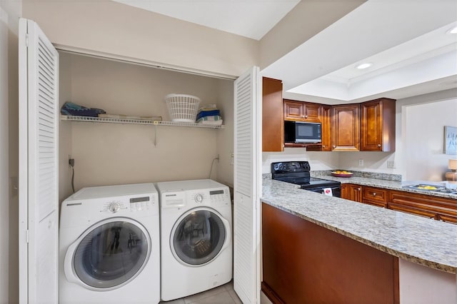 3617 Yellow Pine Ct Unit 144, Sarasota, FL 34238 - washroom featuring independent washer and dryer, light tile patterned flooring, and recessed lighting