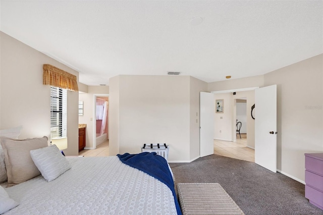 3617 Yellow Pine Ct Unit 144, Sarasota, FL 34238 - unfurnished bedroom with light carpet and ensuite bathroom