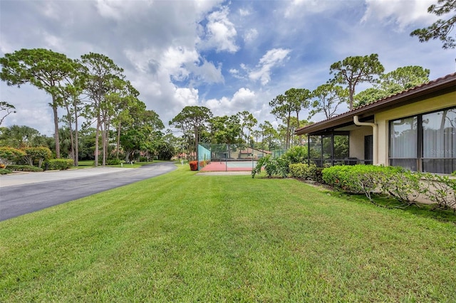 3617 Yellow Pine Ct Unit 144, Sarasota, FL 34238 - view of yard featuring a tennis court
