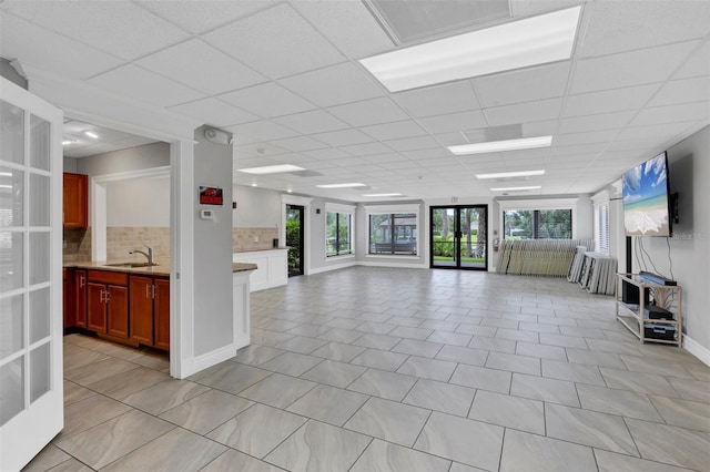 3617 Yellow Pine Ct Unit 144, Sarasota, FL 34238 - unfurnished living room featuring a drop ceiling and a sink