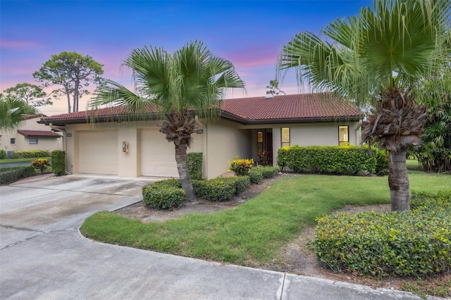 3617 Yellow Pine Ct Unit 144, Sarasota, FL 34238 - single story home with stucco siding, a tile roof, concrete driveway, and a yard