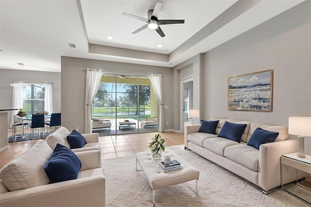 5005 Torrey Pines Run, Bradenton, FL 34211 - living area featuring ceiling fan, light tile patterned flooring, and a raised ceiling