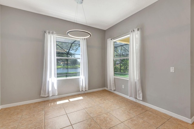 5005 Torrey Pines Run, Bradenton, FL 34211 - empty room featuring healthy amount of natural light and light tile patterned floors