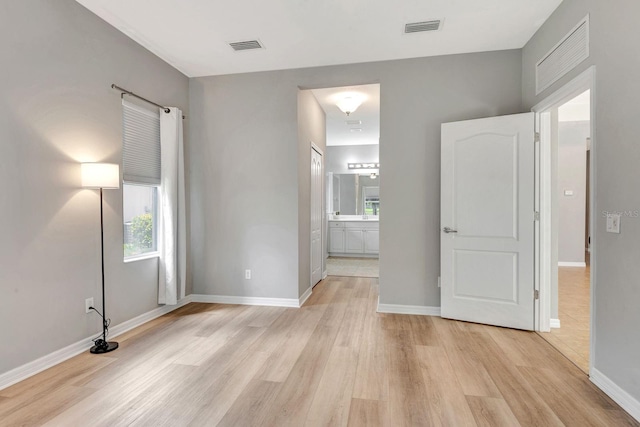 5005 Torrey Pines Run, Bradenton, FL 34211 - unfurnished bedroom featuring light wood-style flooring and ensuite bath