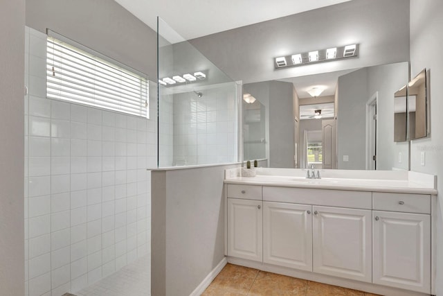 5005 Torrey Pines Run, Bradenton, FL 34211 - bathroom with walk in shower, vanity, tile patterned floors, and ceiling fan