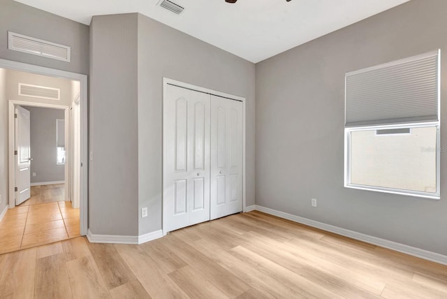 5005 Torrey Pines Run, Bradenton, FL 34211 - unfurnished bedroom featuring light wood finished floors, a closet, and ceiling fan