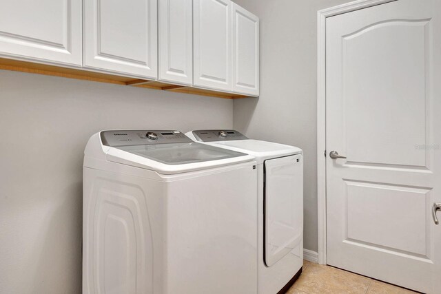 5005 Torrey Pines Run, Bradenton, FL 34211 - laundry room with washer and dryer, cabinet space, and light tile patterned floors