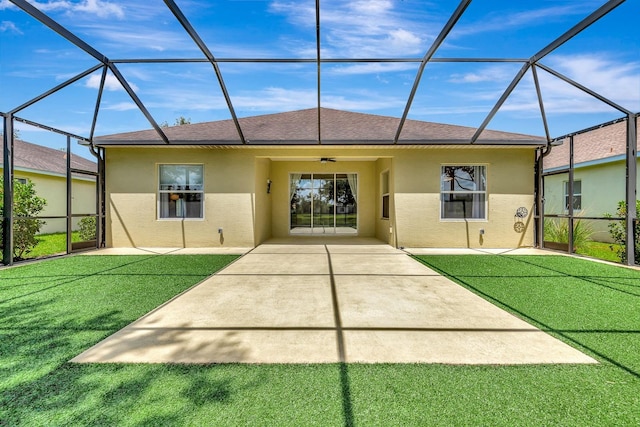 5005 Torrey Pines Run, Bradenton, FL 34211 - back of property featuring stucco siding, a patio area, and glass enclosure